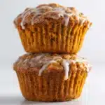 cinnamon roll pumpkin muffins cooling on rack