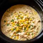 crockpot white chicken chili soup in rustic bowl