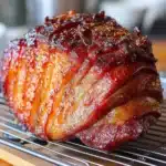 honey baked ham with orange glaze on table
