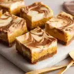 Pumpkin Spice Cheesecake Bars – creamy fall dessert with caramel drizzle