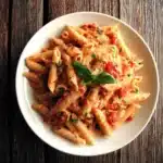 Roasted Tomato Ricotta Pasta in rustic Italian kitchen