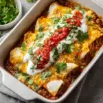 cheesy ground beef enchiladas baked with sauce